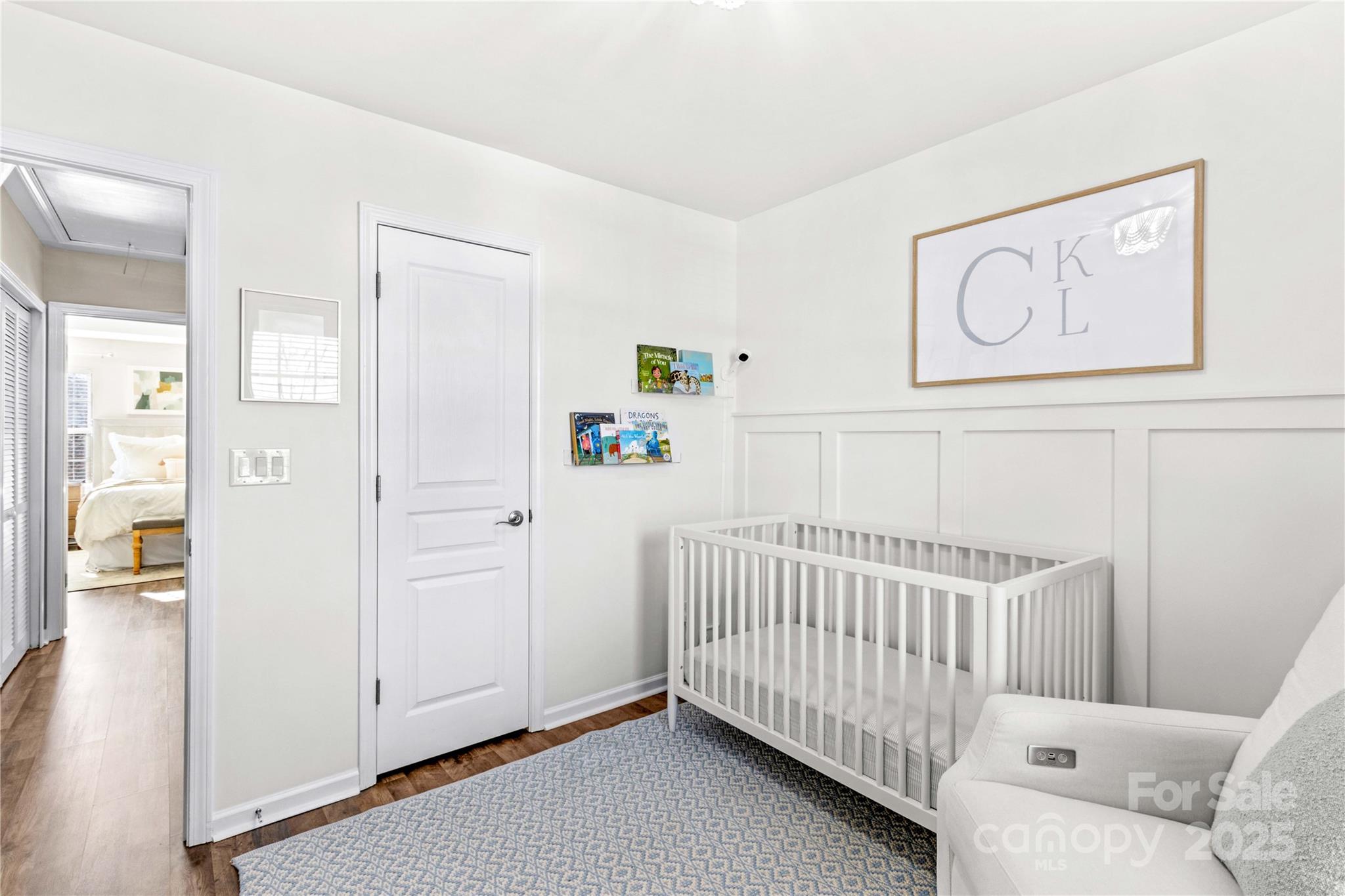 19510 Deer Valley Drive Cornelius, NC 28031 - Photo 30 of 48 a view of a bedroom with furniture and wooden floor