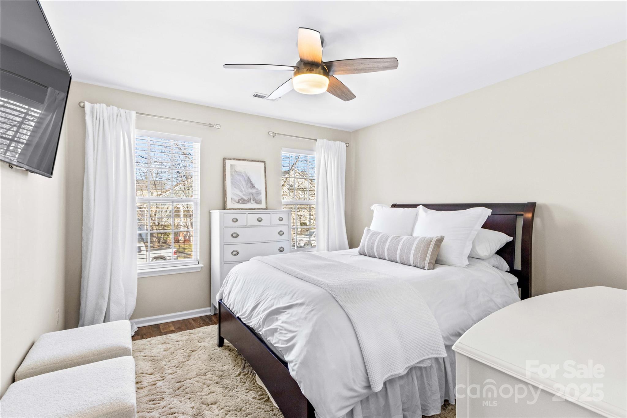 19510 Deer Valley Drive Cornelius, NC 28031 - Photo 32 of 48 a bedroom with a large bed and a window