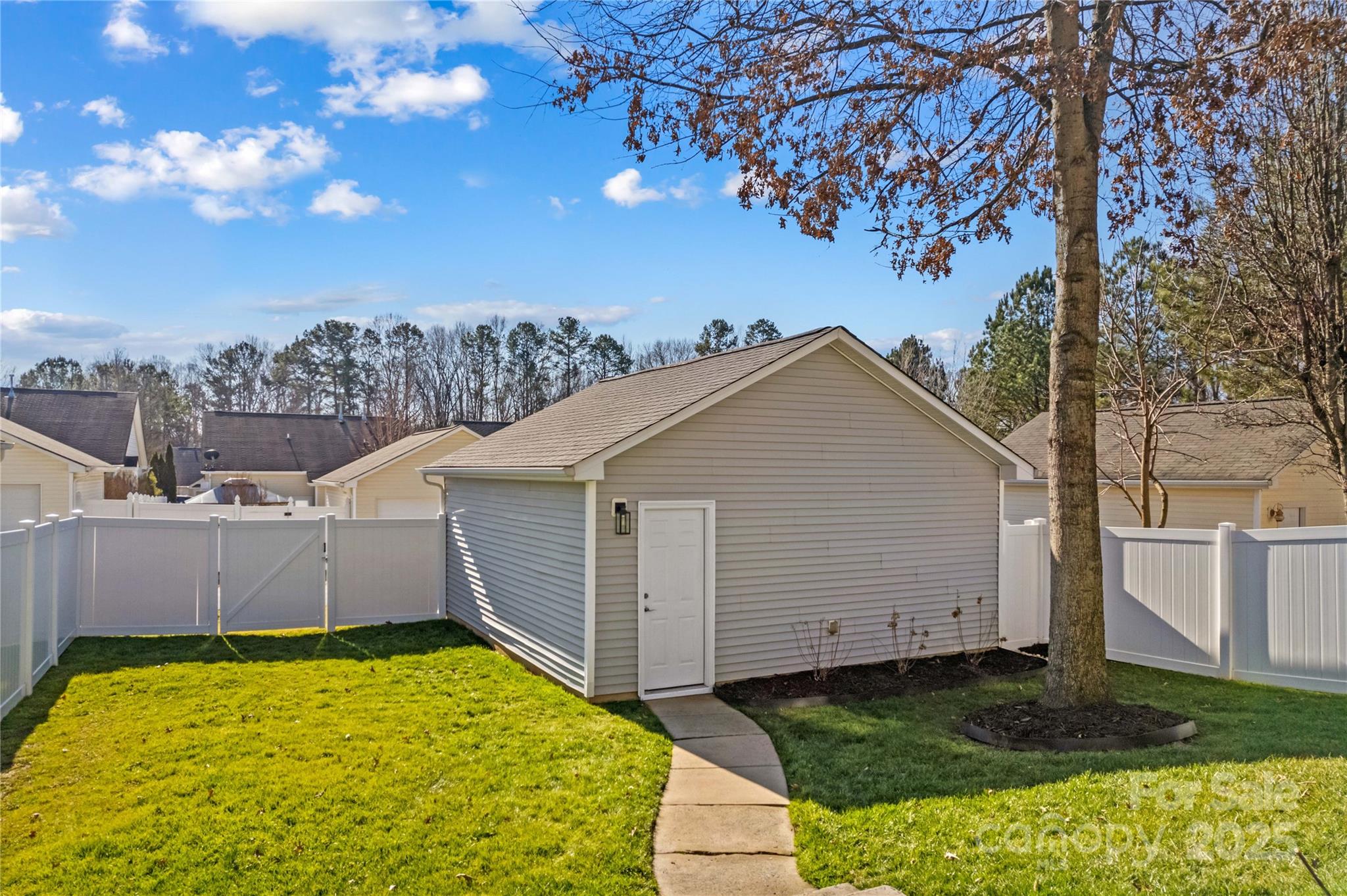 19510 Deer Valley Drive Cornelius, NC 28031 - Photo 40 of 48 a view of a backyard with a tree