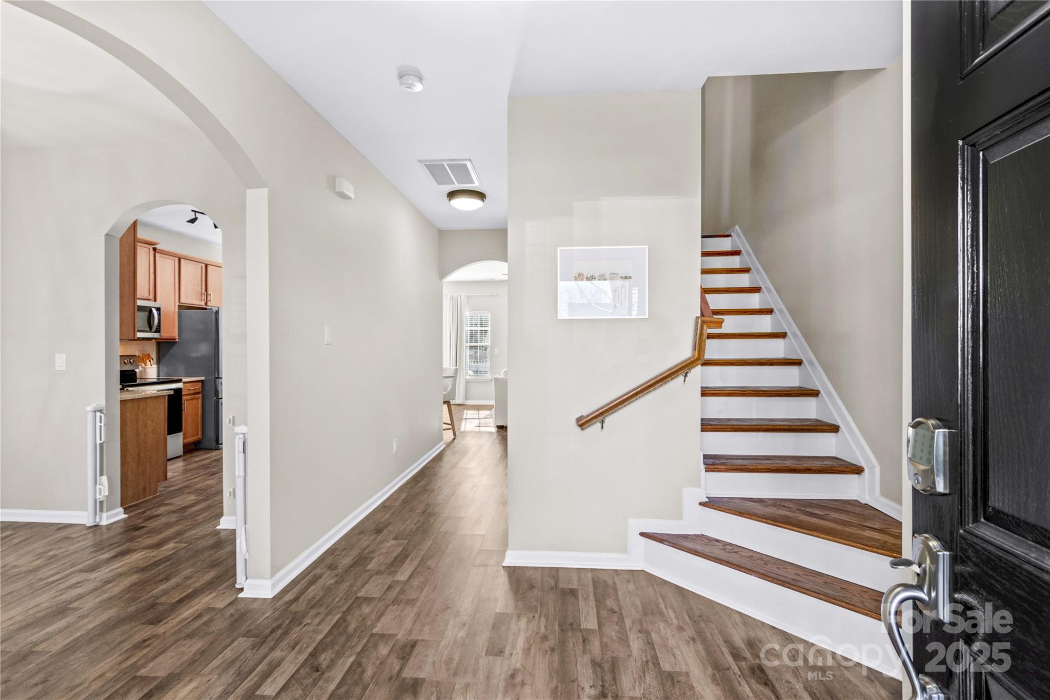 19510 Deer Valley Drive Cornelius, NC 28031 - Photo 5 of 48 a view of a hallway with wooden floor and entryway