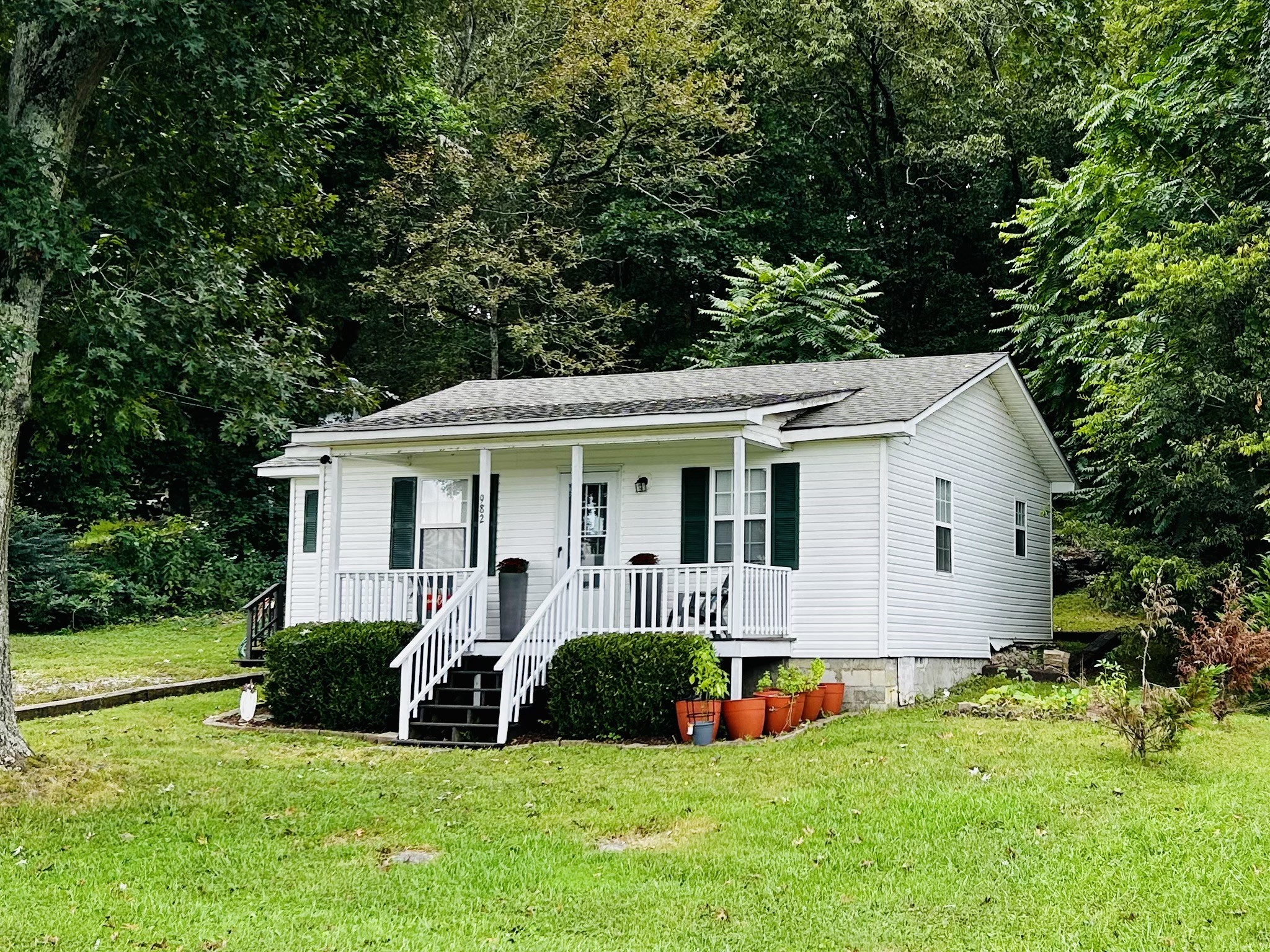 982 Donahue Road Pulaski, TN 38478 - Photo 1 of 12 a front view of house with yard and green space