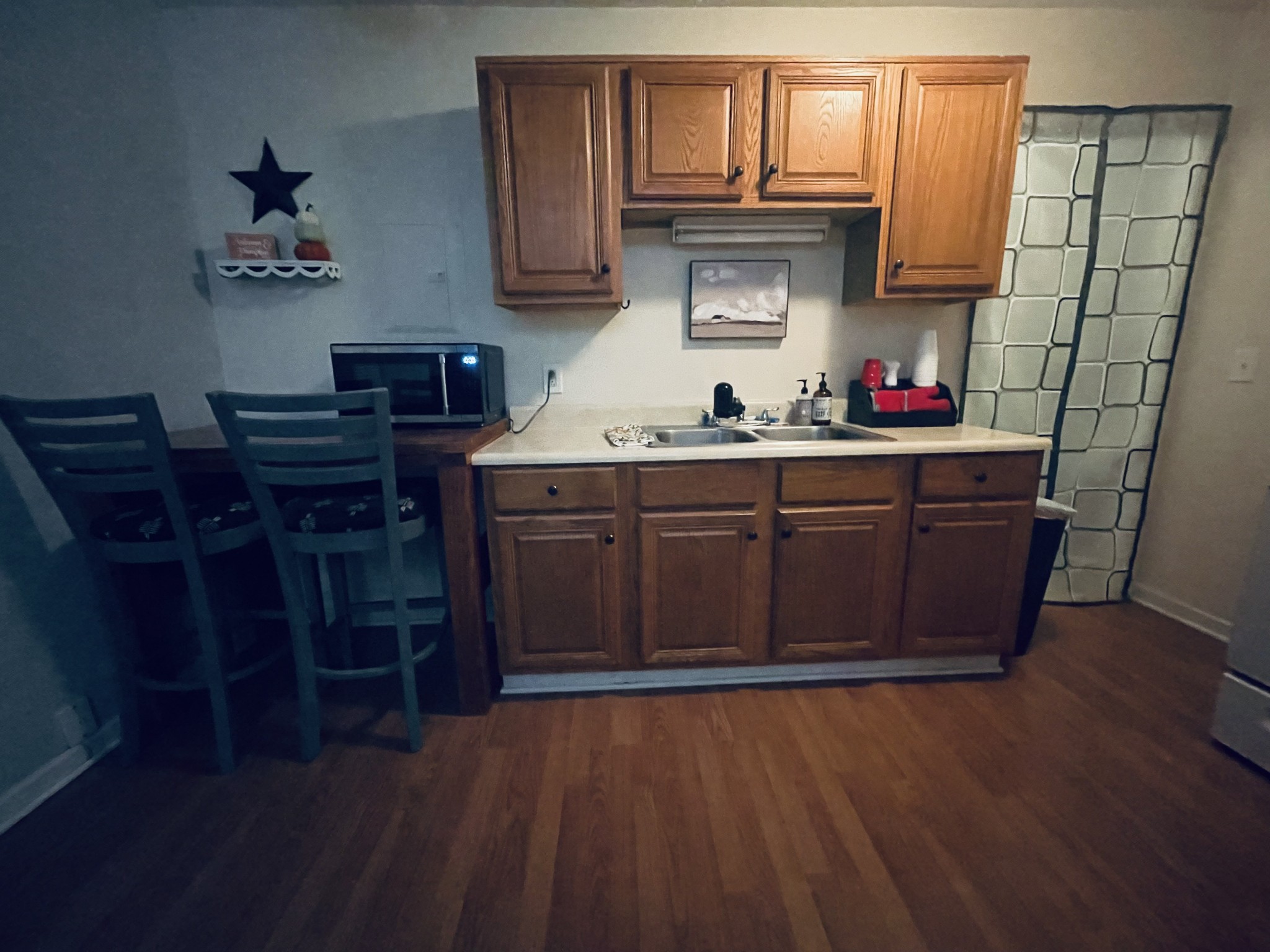 982 Donahue Road Pulaski, TN 38478 - Photo 6 of 12 a kitchen with wooden cabinets and wooden floor