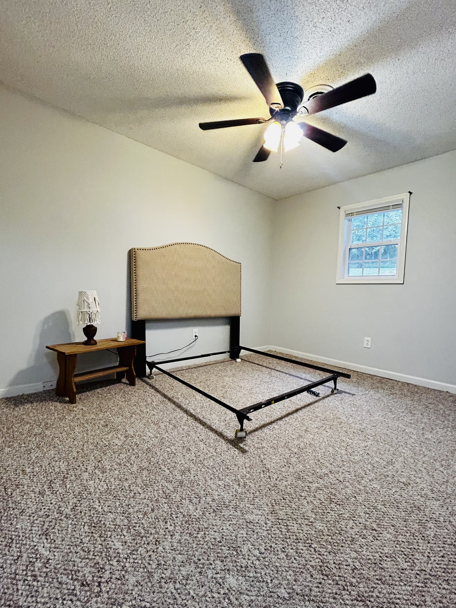 982 Donahue Road Pulaski, TN 38478 - Photo 7 of 12 a bedroom with furniture and a ceiling fan