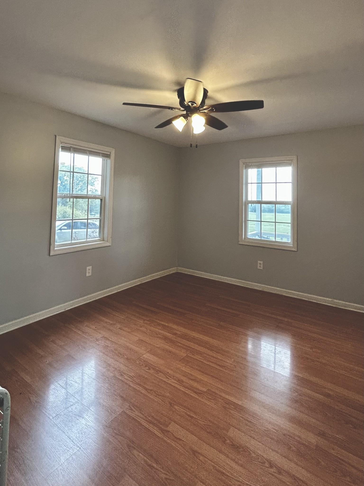 982 Donahue Road Pulaski, TN 38478 - Photo 10 of 12 a view of an empty room with wooden floor and a window