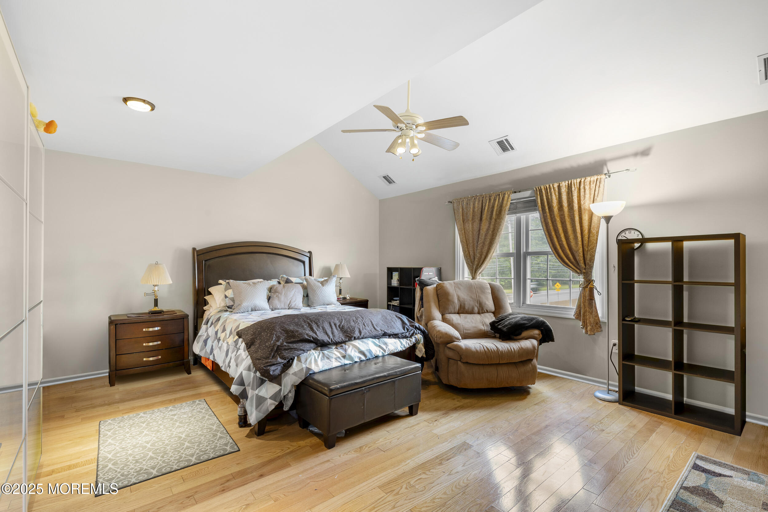 1 Skylark Drive Jackson, NJ 08527 - Photo 29 of 61 a spacious bedroom with a bed a couch and a window