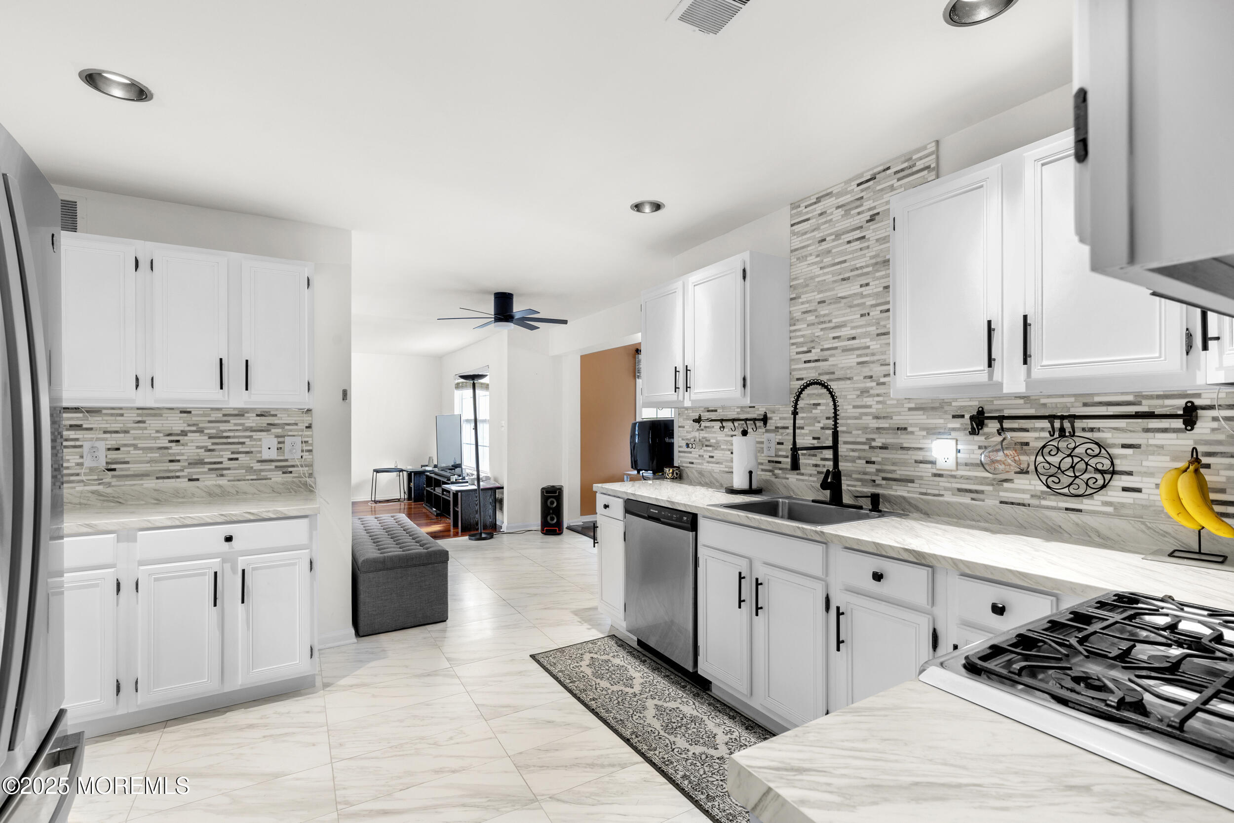 1 Skylark Drive Jackson, NJ 08527 - Photo 8 of 61 a kitchen with stainless steel appliances a stove sink and cabinets
