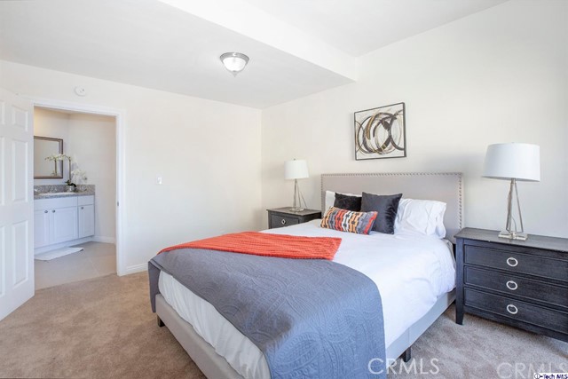1523 East Windsor Road, Unit 209A Glendale, CA 91205 - Photo 20 of 29 a bedroom with a bed and a lamp