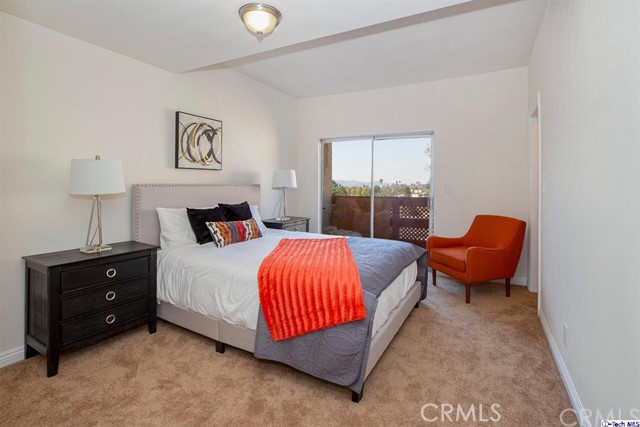 1523 East Windsor Road, Unit 209A Glendale, CA 91205 - Photo 21 of 29 a bedroom with a bed and chair