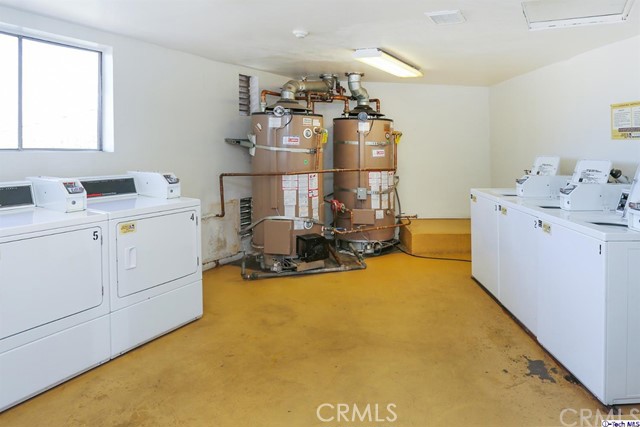 1523 East Windsor Road, Unit 209A Glendale, CA 91205 - Photo 27 of 29 a view of a room with gym equipment and windows