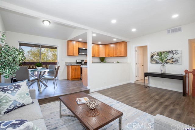 1523 East Windsor Road, Unit 209A Glendale, CA 91205 - Photo 4 of 29 a living room with furniture and a wooden floor