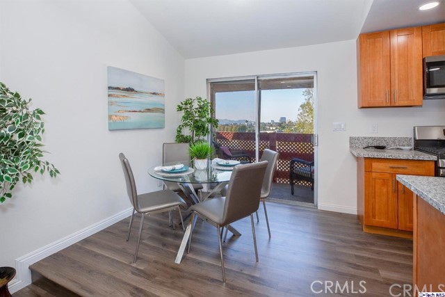 1523 East Windsor Road, Unit 209A Glendale, CA 91205 - Photo 5 of 29 a dining room with furniture and wooden floor