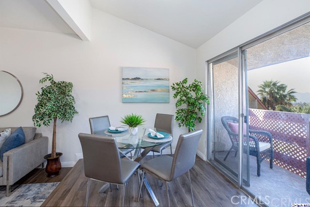 1523 East Windsor Road, Unit 209A Glendale, CA 91205 - Photo 6 of 29 a view of a dining room with furniture window and wooden floor