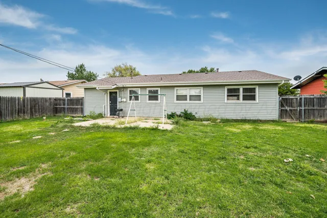 a bathroom with a sink a toilet a mirror and shower
