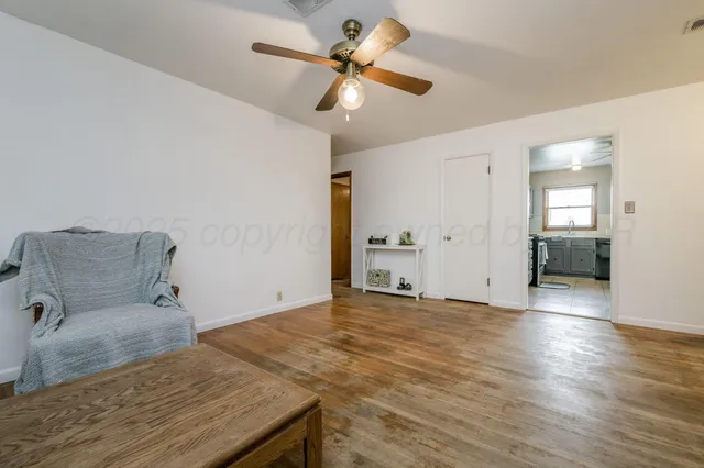 a view of a livingroom with a hardwood floor