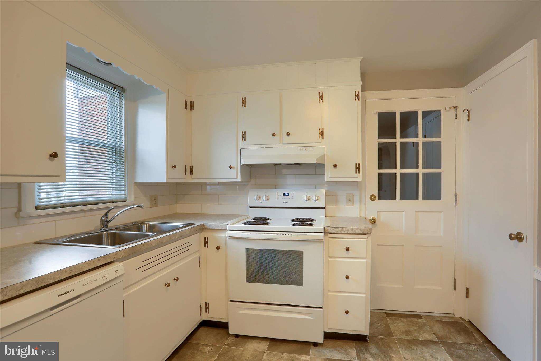 1515 Esbenshade Road Lancaster, PA 17601 - Photo 14 of 34 a kitchen with cabinets appliances a sink and a window