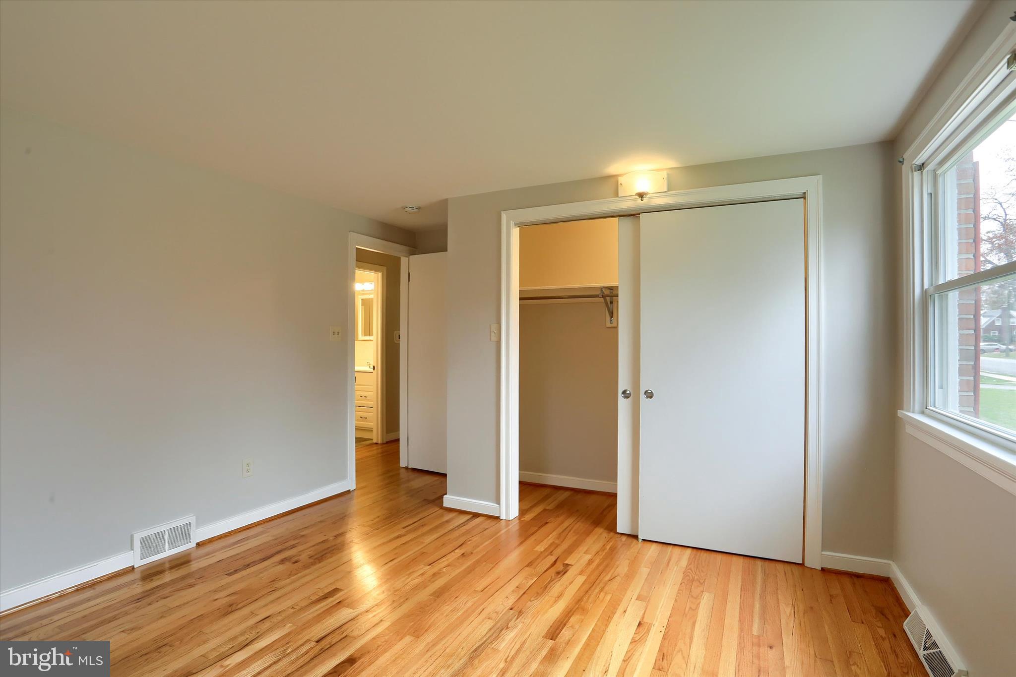 1515 Esbenshade Road Lancaster, PA 17601 - Photo 5 of 34 an empty room with wooden floor and windows