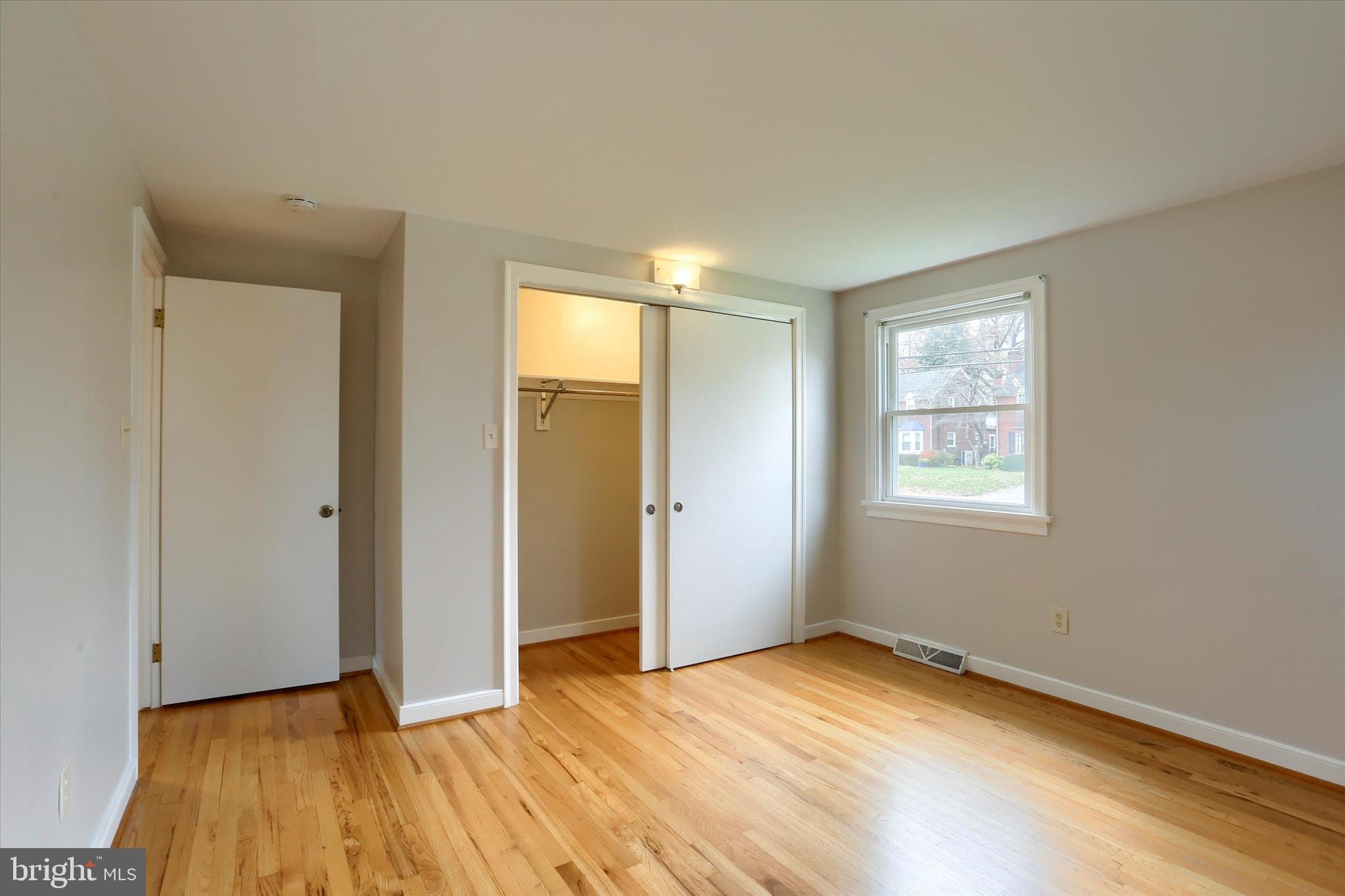 1515 Esbenshade Road Lancaster, PA 17601 - Photo 6 of 34 an empty room with wooden floor and windows