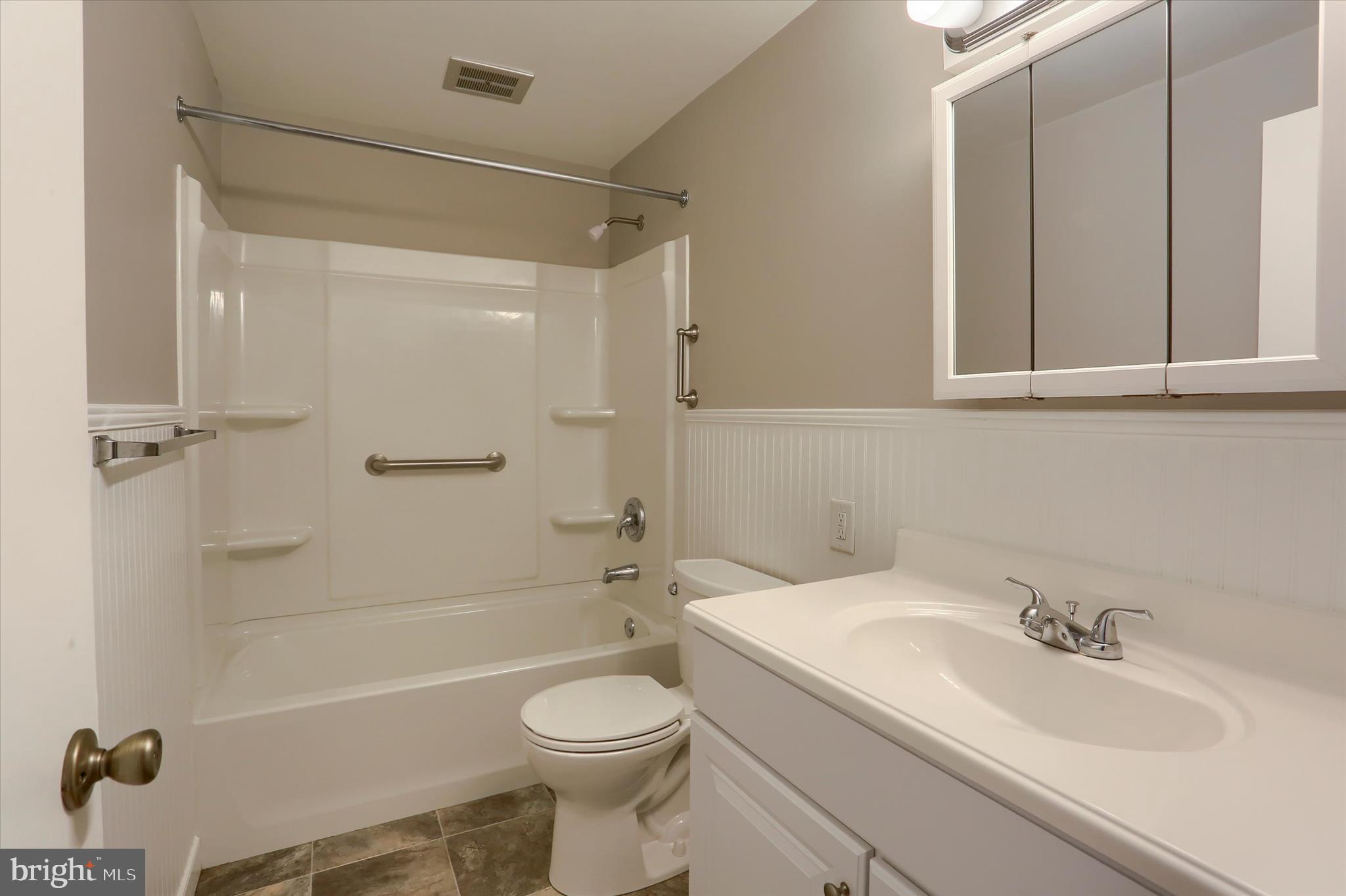 1515 Esbenshade Road Lancaster, PA 17601 - Photo 9 of 34 a bathroom with a granite countertop sink toilet and shower