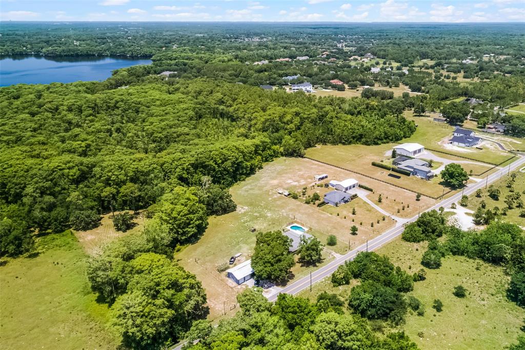 1508 Lake Mills Road Chuluota, FL 32766 - Photo 12 of 37 an aerial view of residential houses with outdoor space