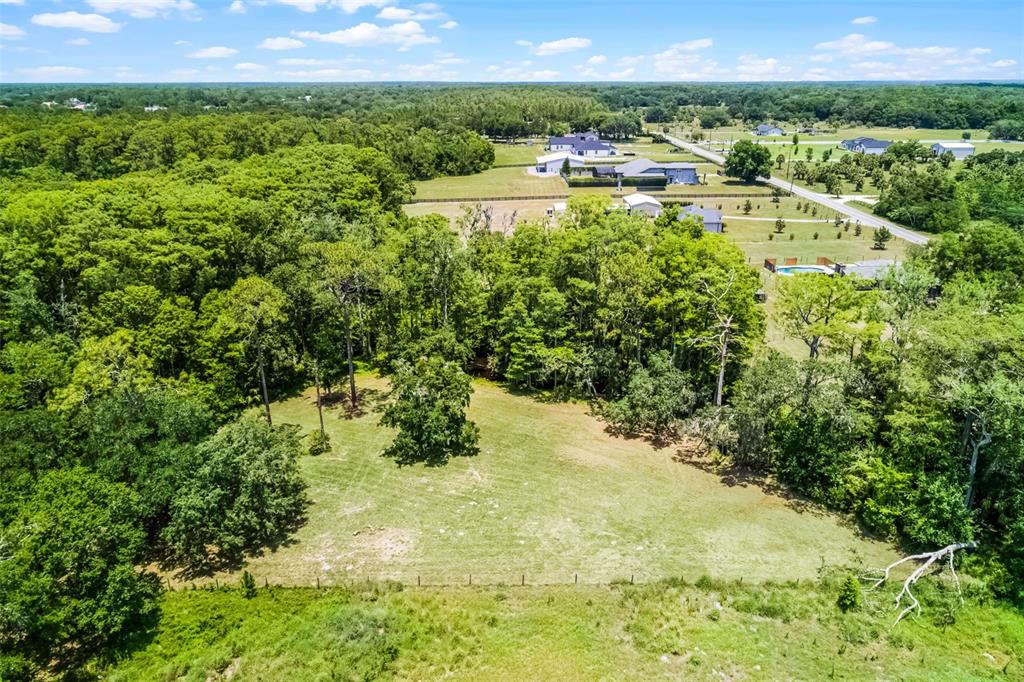 1508 Lake Mills Road Chuluota, FL 32766 - Photo 17 of 37 a view of a lake with a yard