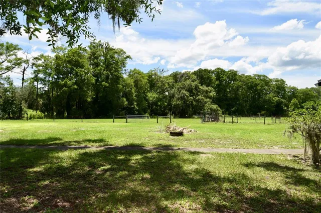 a view of room with a window and a ceiling fan