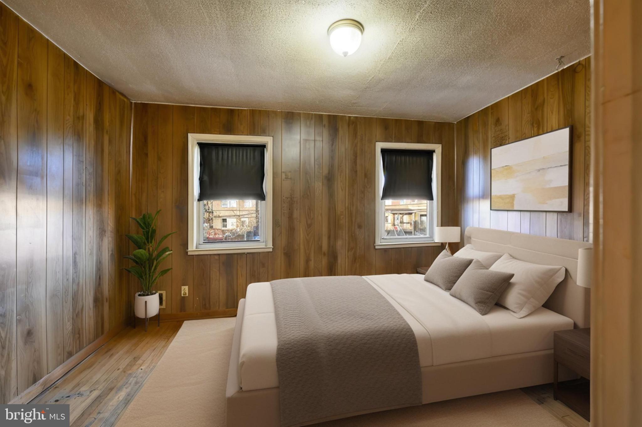 414 Kane Street Baltimore, MD 21224 - Photo 6 of 15 a bedroom with a bed and a window