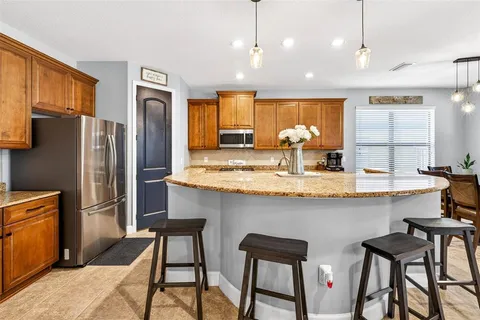 a view of a dining room with furniture and window