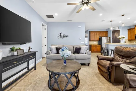 a bathroom with a granite countertop sink a bathtub and shower