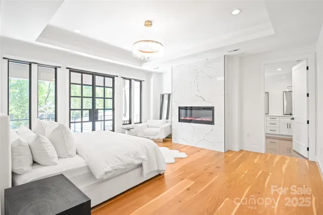 a bedroom with a large bed and a large window