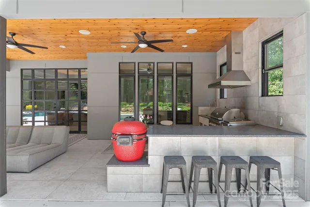 a sitting area with furniture and a garden