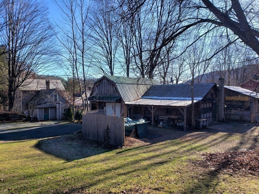 4 Pleasant Street Huntington, MA 01050 - Photo 14 of 38 a view of a house with a yard covered with snow in front of house
