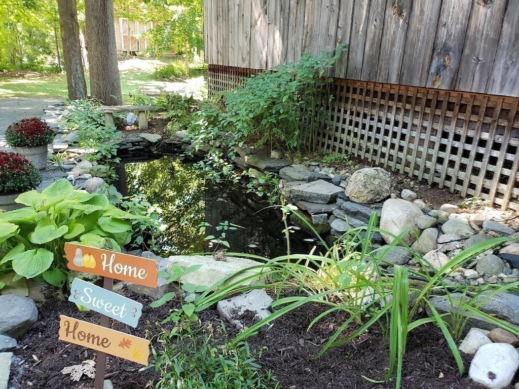 4 Pleasant Street Huntington, MA 01050 - Photo 17 of 38 a backyard of a house with lots of green space