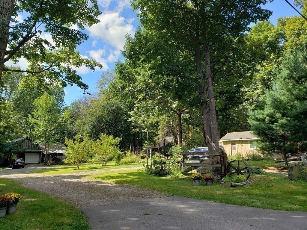 4 Pleasant Street Huntington, MA 01050 - Photo 24 of 38 a front view of a house with a yard and trees