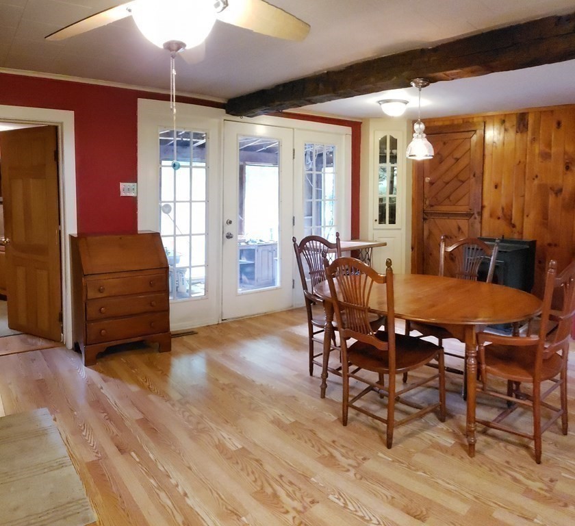 4 Pleasant Street Huntington, MA 01050 - Photo 27 of 38 a view of a dining room with furniture and chandelier