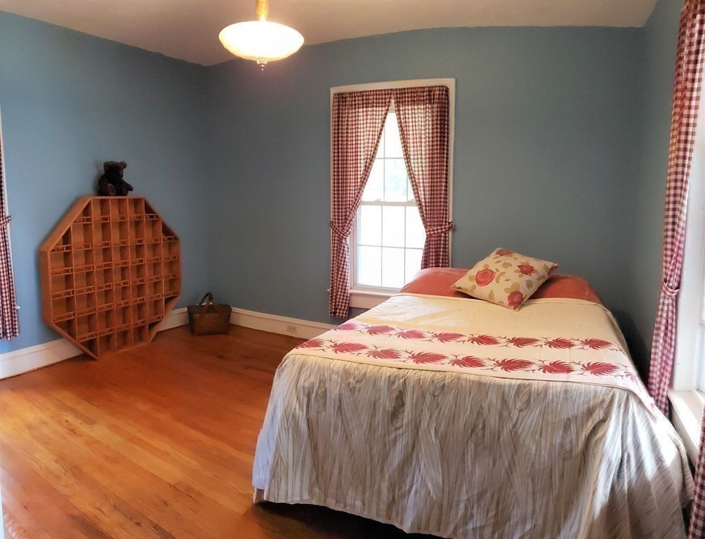 4 Pleasant Street Huntington, MA 01050 - Photo 29 of 38 a bedroom with a bed and window