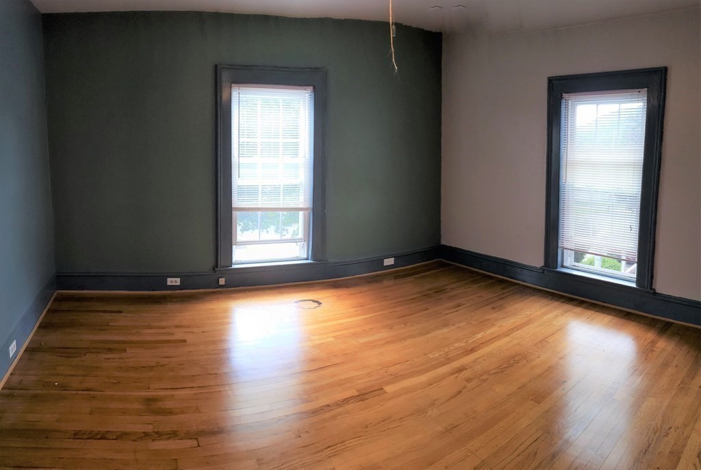 4 Pleasant Street Huntington, MA 01050 - Photo 37 of 38 an empty room with wooden floor and windows