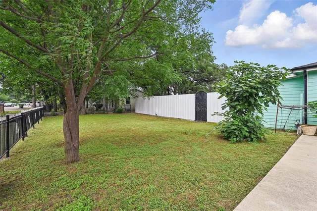 a backyard of a house with lots of green space