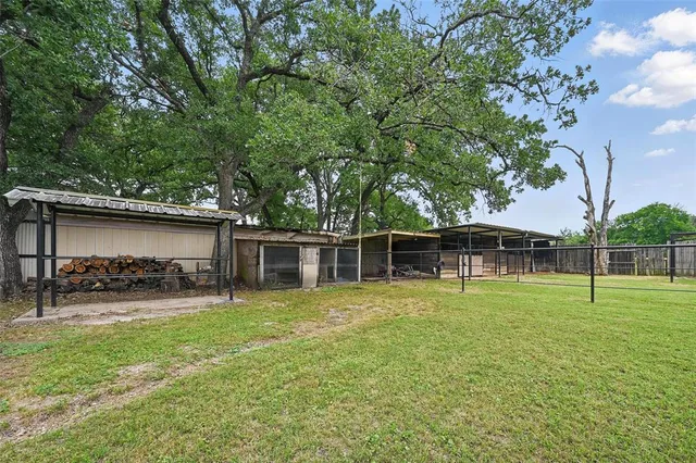 a house with trees in the background
