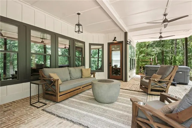 a living room with furniture and a large window