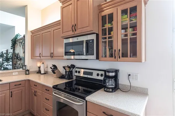a kitchen with cabinets and appliances