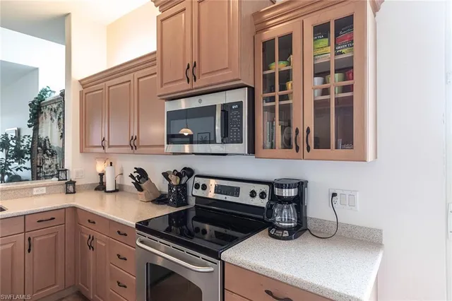 a kitchen with cabinets and appliances