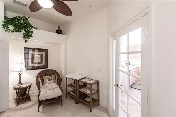 a view of a livingroom with furniture and a window