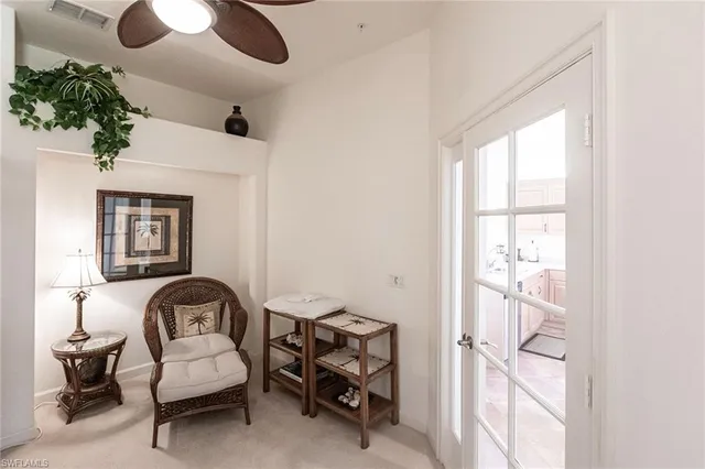 a view of a livingroom with furniture and a window