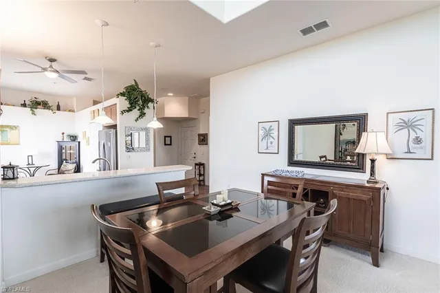 a kitchen with a table and chairs in it