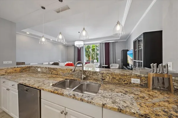 a kitchen with center island table and chairs