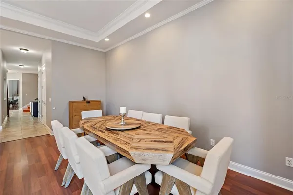 a living room with furniture a window and a clock