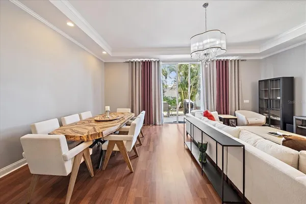 a view of a livingroom with workspace and a window