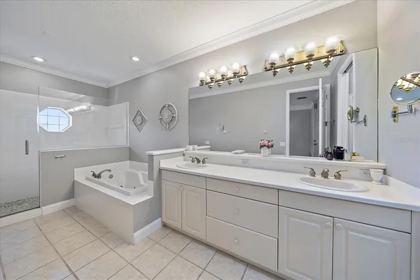 a view of a patio with table and chairs with wooden fence and plants