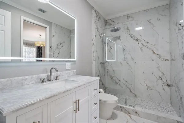 a view of a patio with table and chairs and potted plants