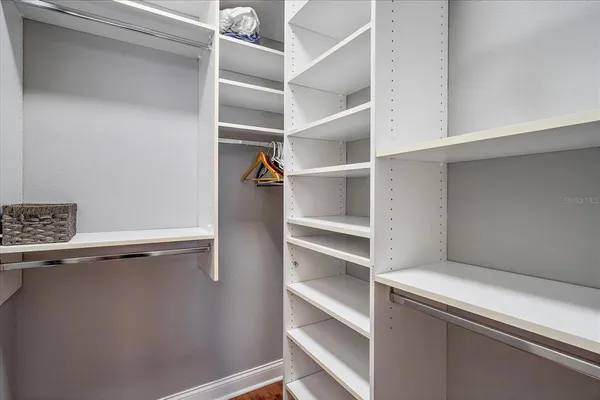 a view of a patio with table and chairs and potted plants
